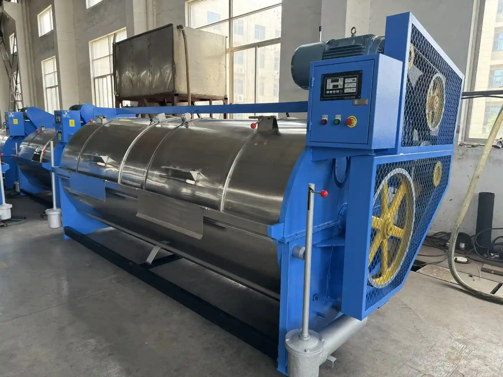 Skilled technicians working on Dry Cleaning Machine assembly